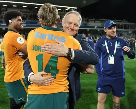 Wallabies coach Joe Schmidt hugs Max Jorgensen