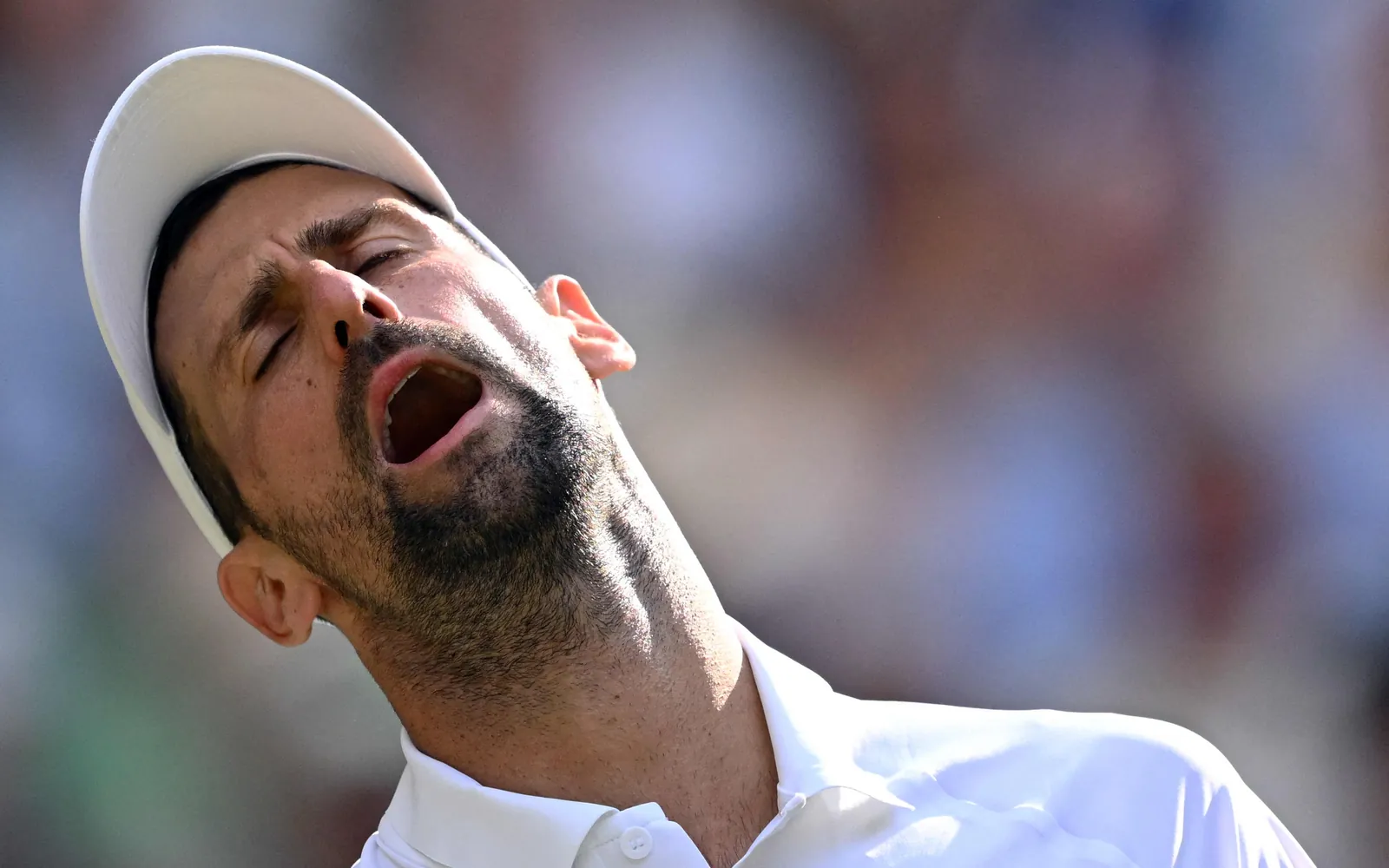 Serbia's Novak Djokovic reacts as he plays against Italy's Jannik Sinner during their men's singles semi-final match at Wimbledon.
