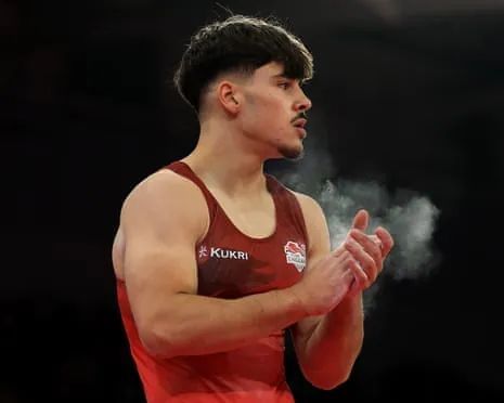 Gabriel Langton chalks up prior to his floor routine